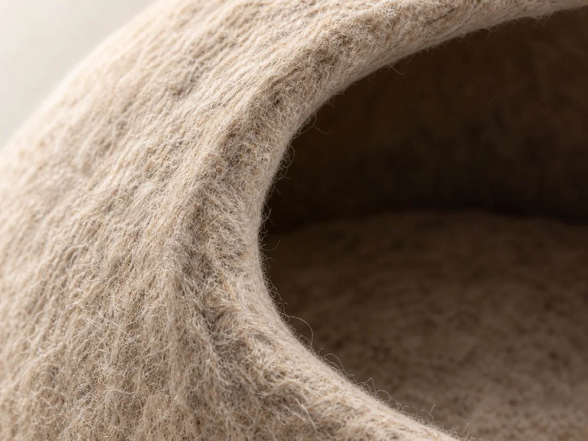 Cat cave bed illustrative construction close-up